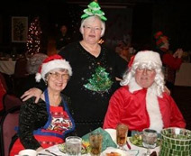 Mr. & Mrs. Santa (the Cloyds) with the tree (Nancy Murry)