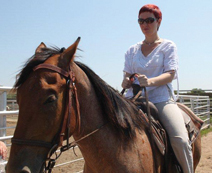 A wild Russian woman on a (tamed) wild mustang